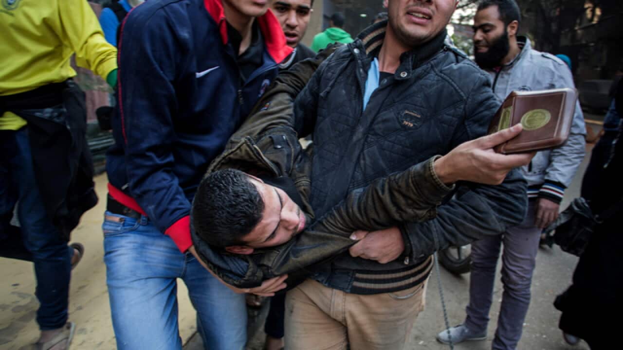 A protester wounded in clashes with security forces in Cairo, Egypt