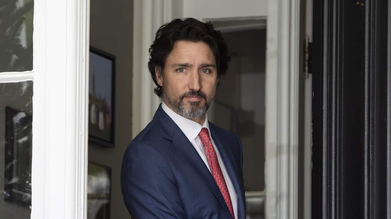 Canadian Prime Minister Justin Trudeau arrives for his daily news conference on the COVID-19 pandemic outside his residence at Rideau Cottage in Ottawa, Ontario, on Tuesday, May 19, 2020. (Justin Tang/The Canadian Press via AP)