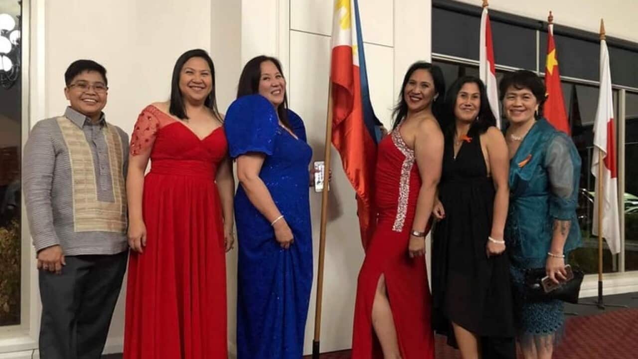 Belle R Woods in blue gown