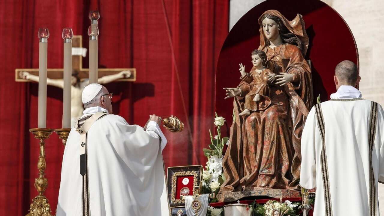 Pope Francis (L) leads the canonization Mass of Pope Paul VI and Salvadoran Archbishop Oscar Romero.