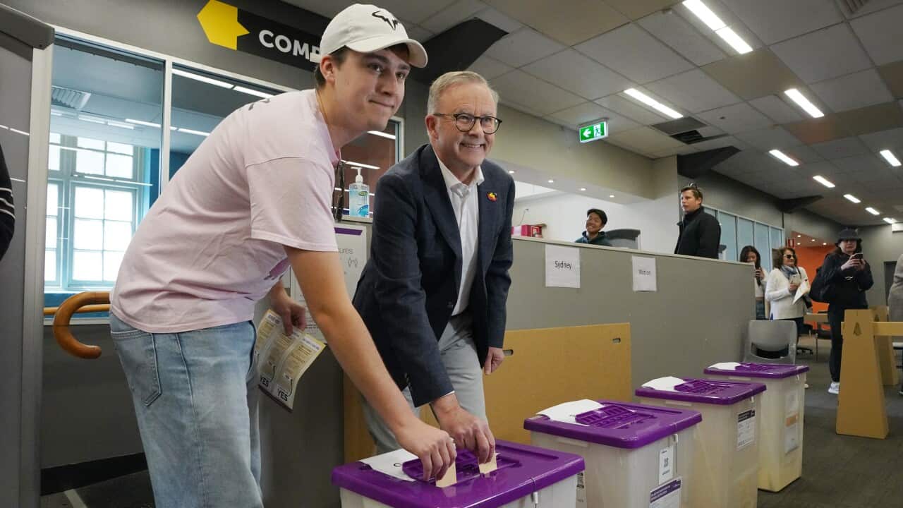 Two men casting their votes in the Voice to parliament referendum