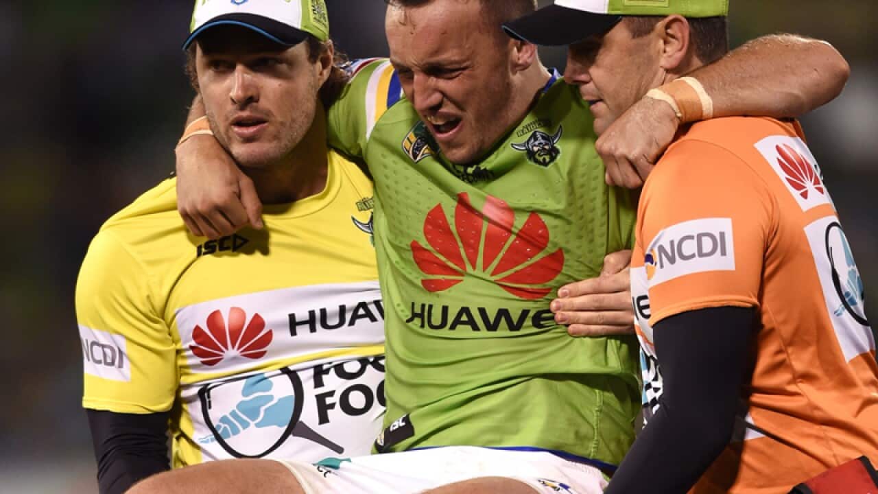 Josh Hodgson (centre) of the Raiders