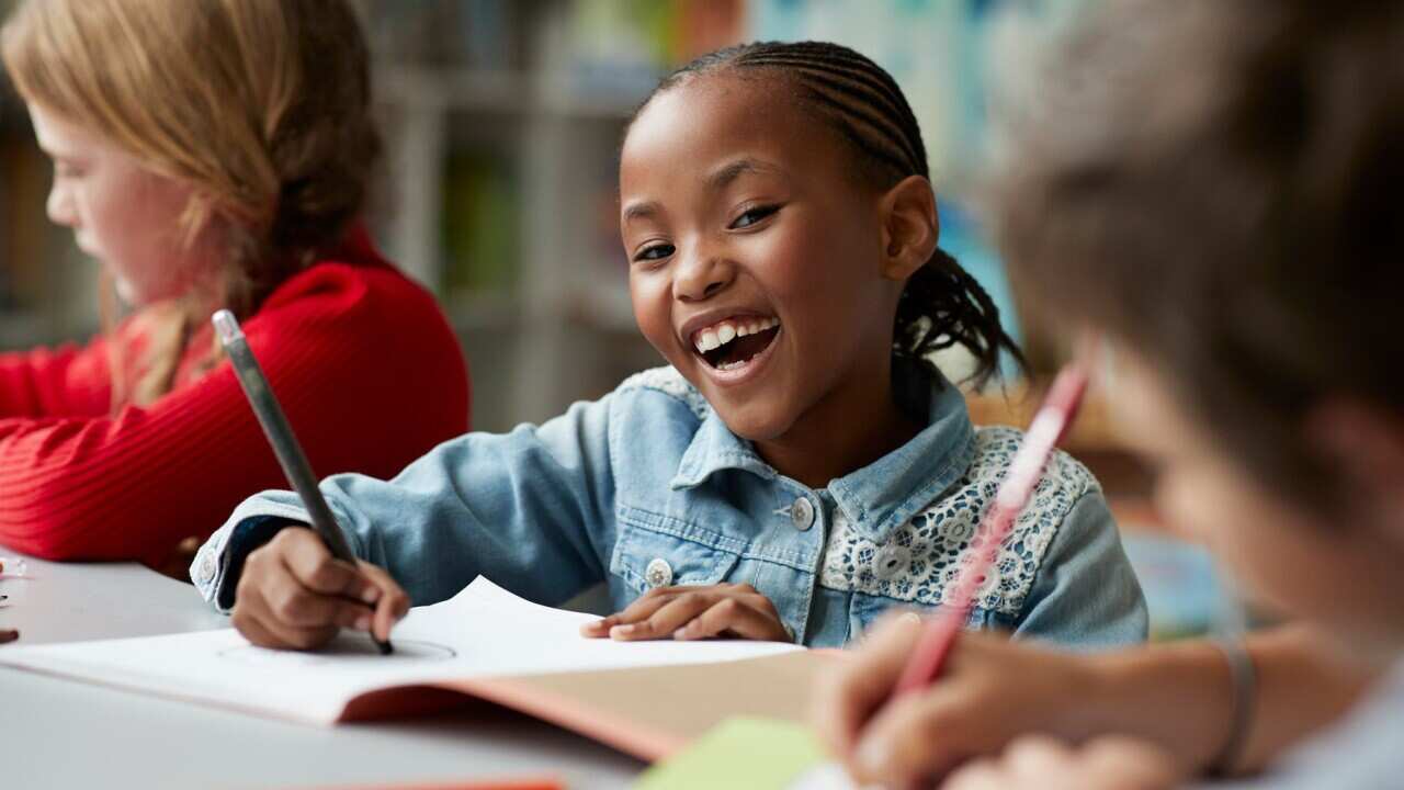 schoolgirl drawing at the school library