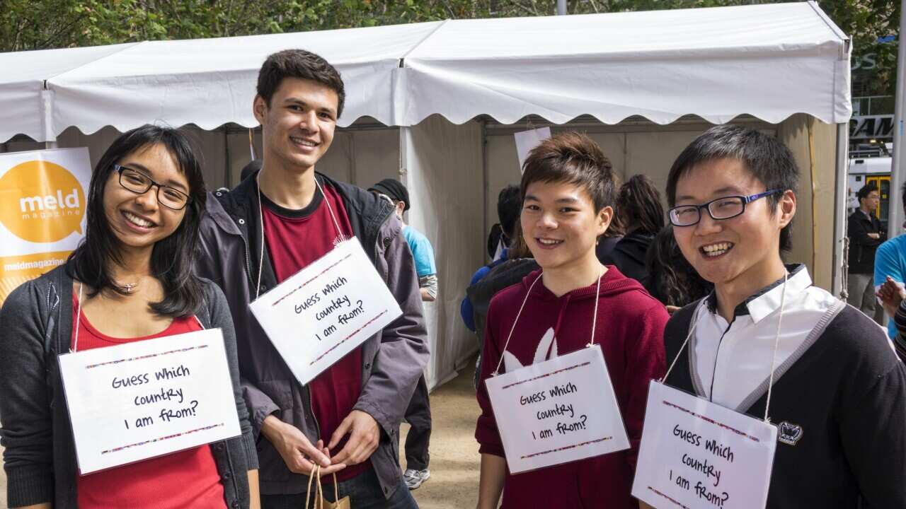 Australia, Victoria festival Lord Mayor's Student Welcome international student wearing sign orientation