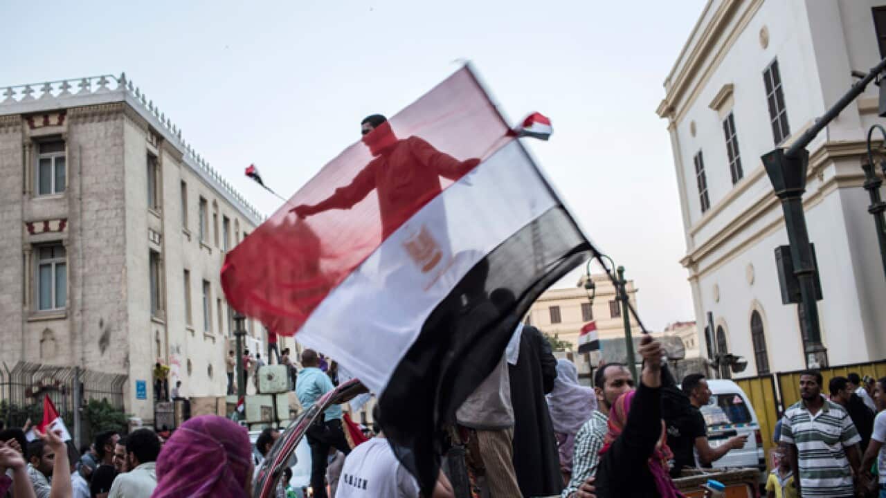 Egyptians celebrate the victory of the Muslim Brotherhood in Cairo. (Getty images)
