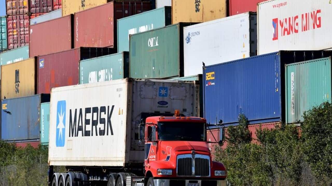 A truck transporting a shipping container