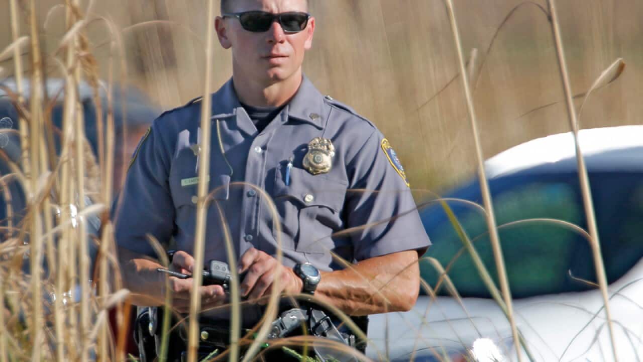 Police at a checkpoint at Will Rogers World Airport