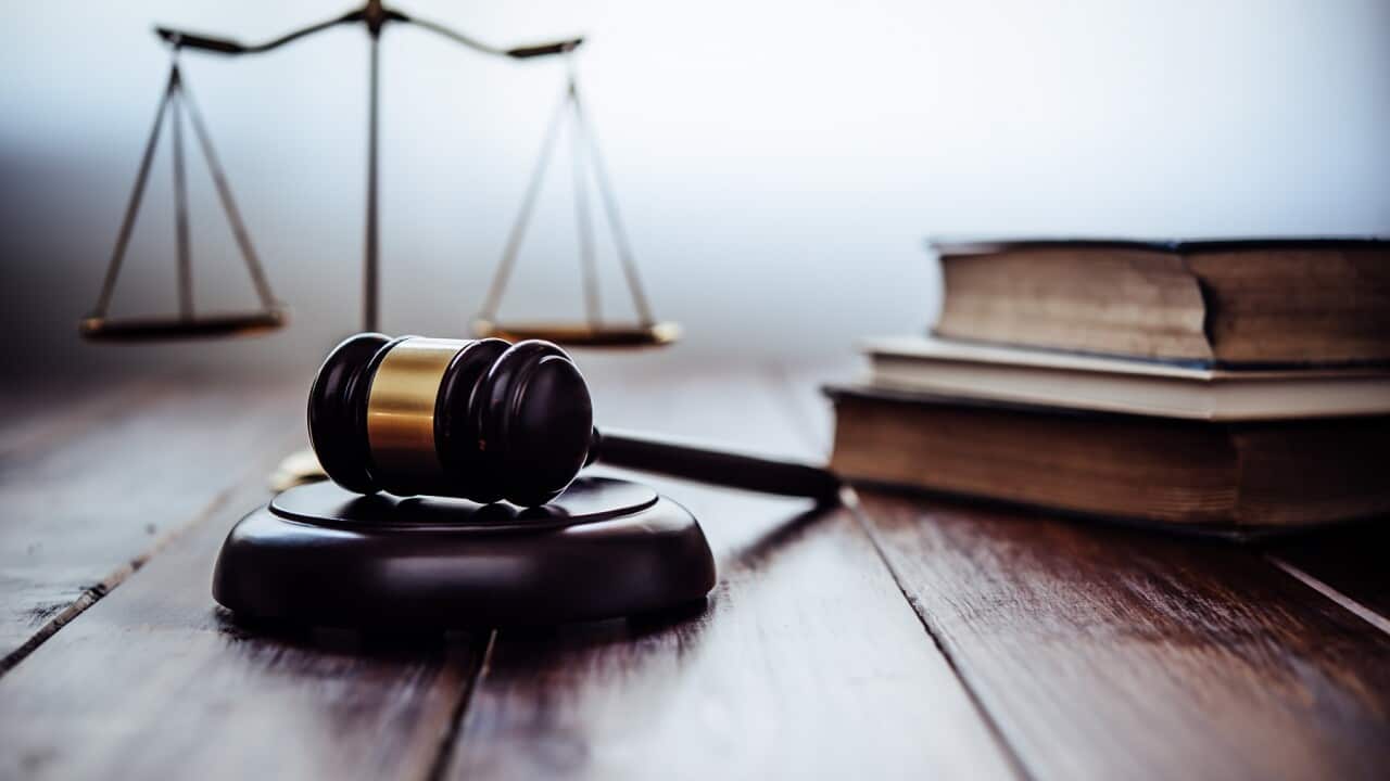 Close-Up Of Gavel On Table