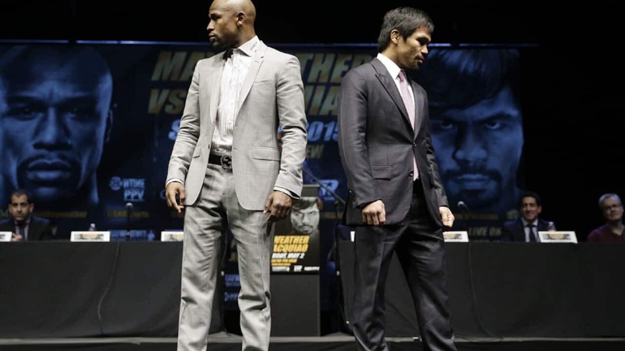 Boxers Floyd Mayweather Jr., left, and Manny Pacquiao