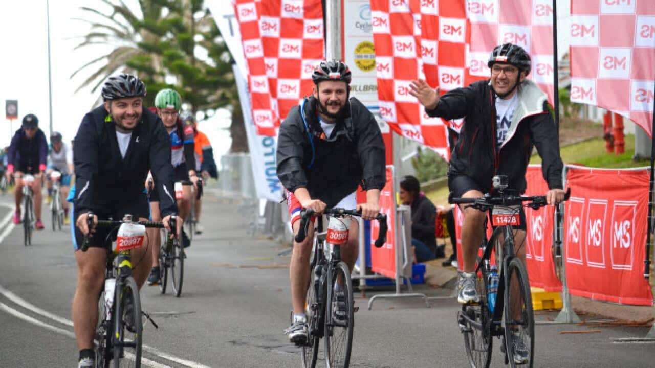 Cyclists part of the Serbian Festival Sydney team cross the finish line at the 2017 MS Sydney to the Gong charity bike ride.