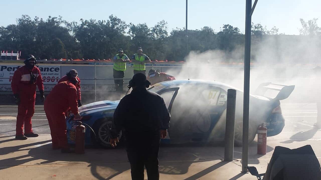 Paul Morris's Ford on fire in the pit lane