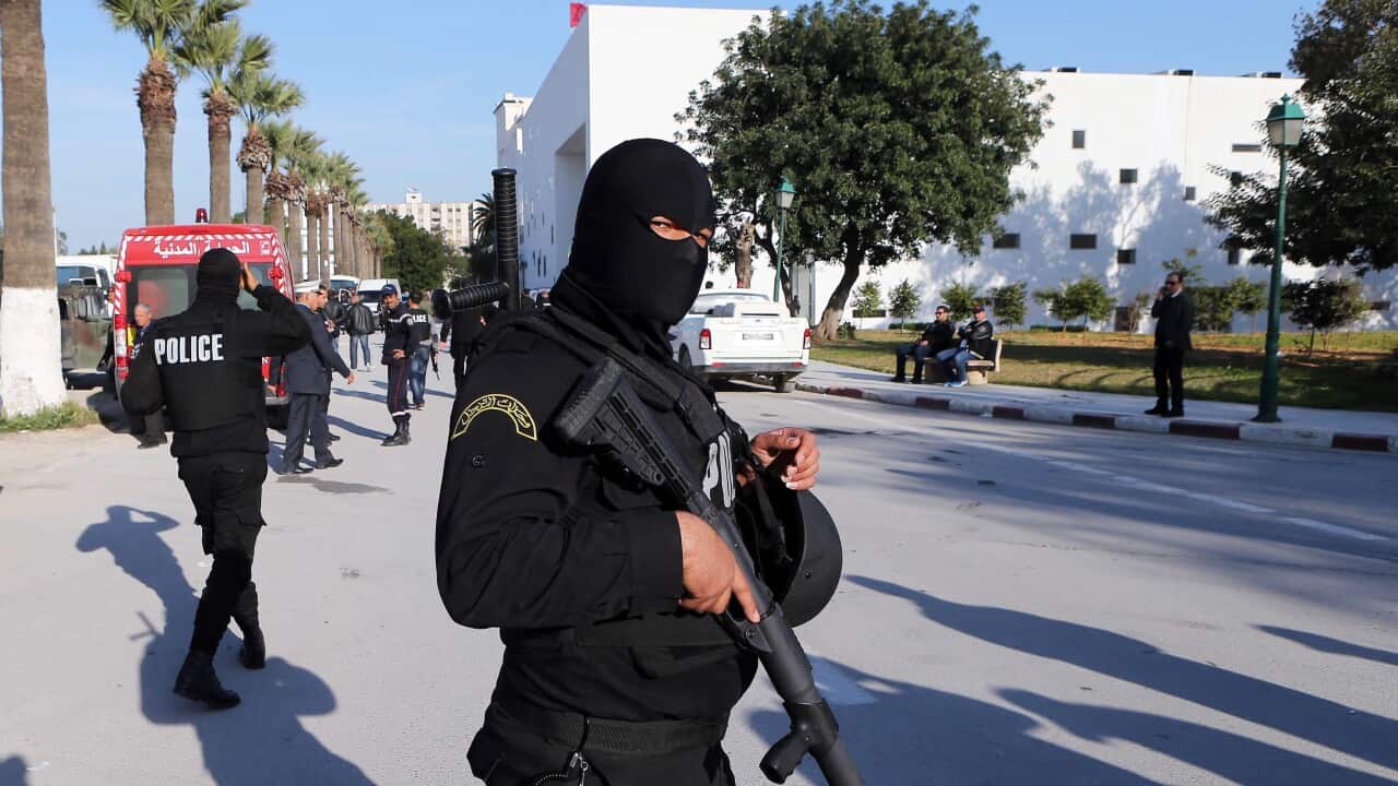 A member of the Tunisian security services stands near the scene of an attack targeting tourists at the National Bardo Museum, Tunis, Tunisia, 18 March 2015. (EPA/MOHAMMED MESSARA)