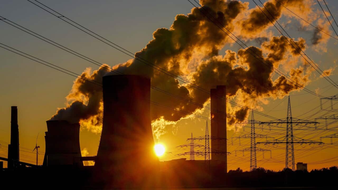 FILE - Steam comes out of the chimneys of the coal-fired power station in Niederaussem, Germany, Sunday, Oct. 24, 2021. (AP Photo/Michael Probst, File)