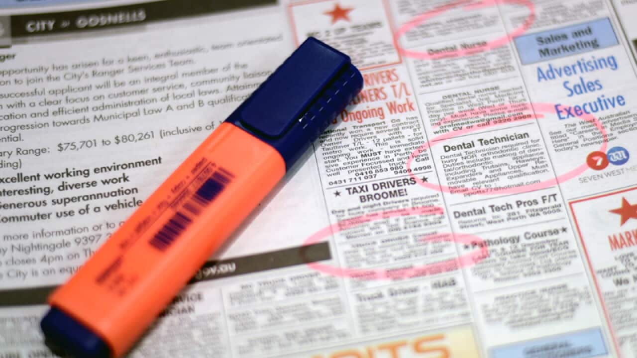 Job adverts are seen in a weekend newpaper