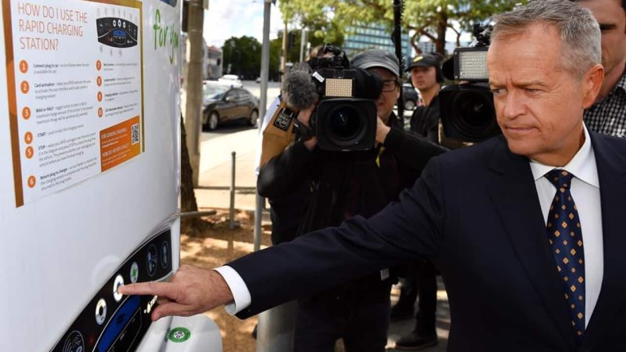 Bill Shorten at electric car charging point.