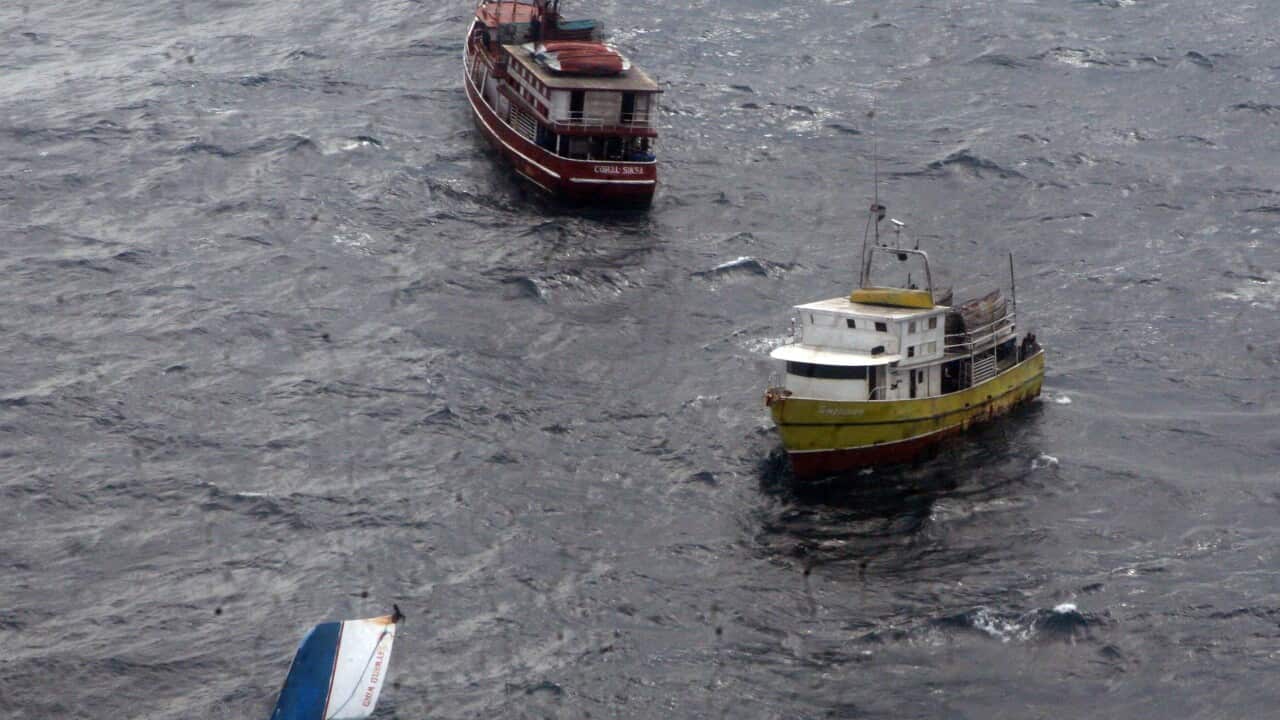 The Nicaraguan lobster boat, MN Wayward Wind, lies half submerged in Caribbean Ocean, 35 nautical miles (65 kilometers) southeast from the port of Puerto Cabezas, also known as Bilwi, Nicaragua, Sunday Dec. 14 2014. Another boat has sunk with 13 reported