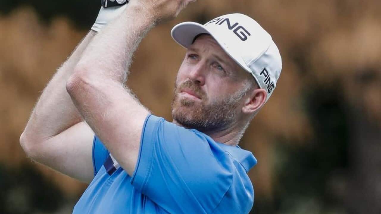 Golfer Adam Bland in action