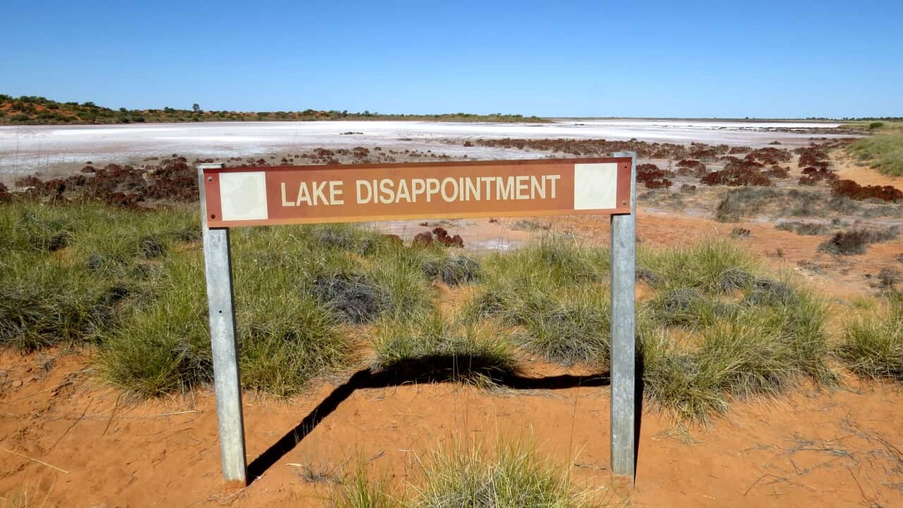 A sign in front of Lake Disappointment