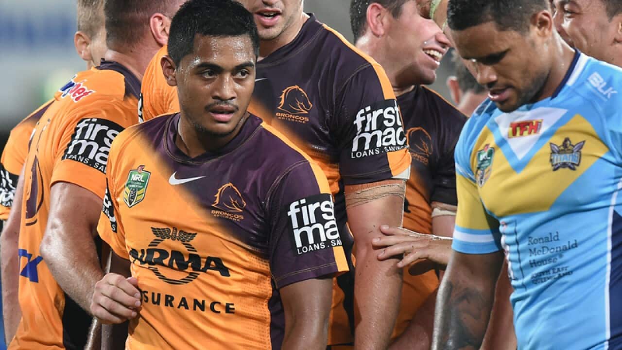 Broncos players celebrate with Anthony Milford