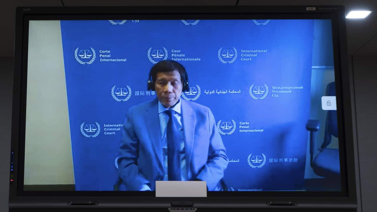 Former Philippine President Duterte stands pre-trial at ICC in The Hague