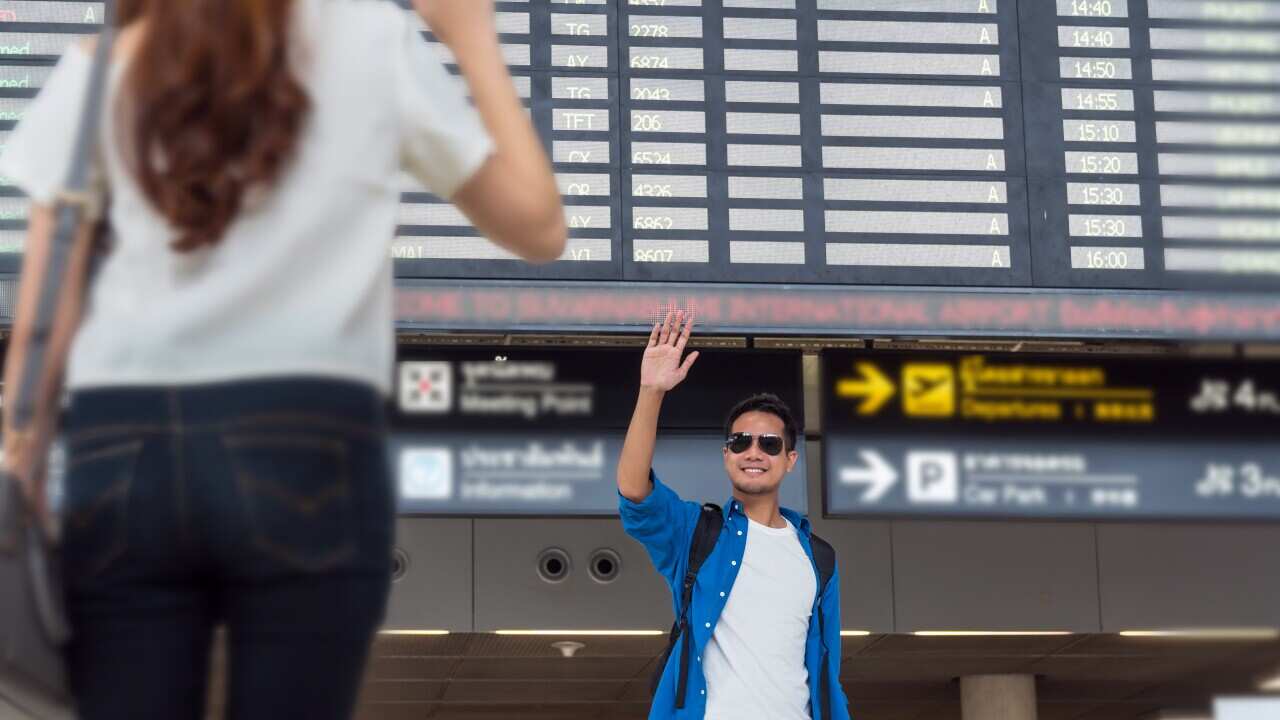 Asian couple traveler with suitcases at the airport. Lover trave
