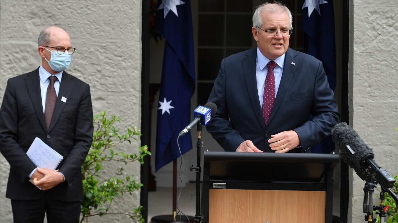 Chief Medical Officer Paul Kelly and Prime Minister Scott Morrison during a press conference at Kirribilli House in Sydney on 29 December.