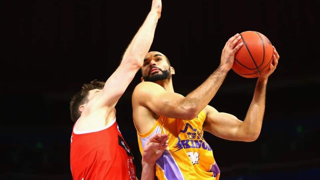 Perry Ellis of the Kings drives to the basket.
