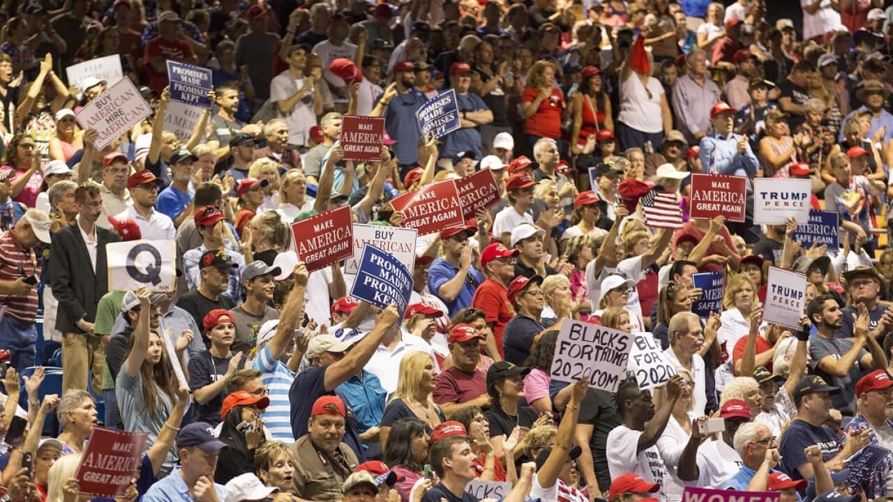People cheer as US President Donald J. Trump (not pictured) speaks at the Florida State Fairgrounds Expo Hall in Tampa, Florida, USA, 31 July 2018.