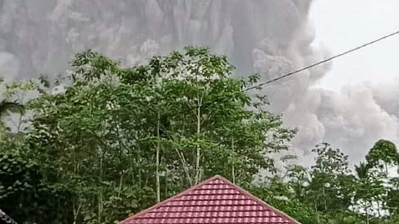 Mount Semeru spews volcanic ash during an eruption in Lumajang, East Java, 4 December 2021.