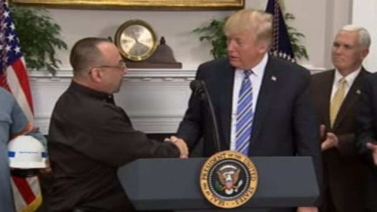Donald Trump thanking a US steelworker.