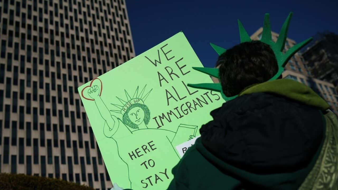 Immigration activists and clergy members participate in a silent prayer walk in protest against the Trump administration's immigration policies .