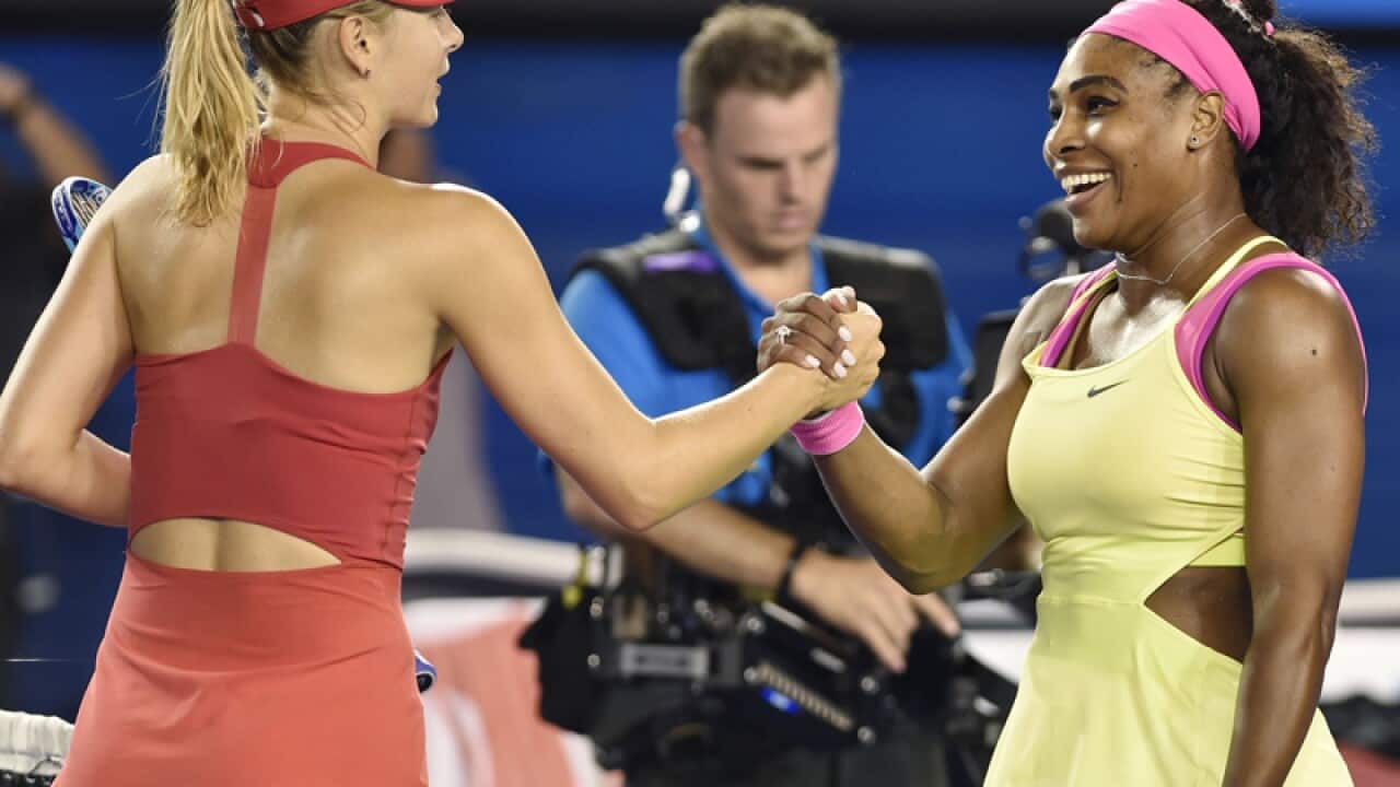 Serena Williams (R) shakes hands with Maria Sharapova.