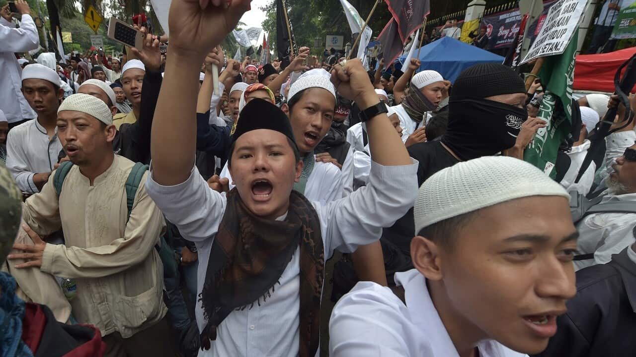 Protesters chant slogans against former Jakarta governor Basuki Tjahaja Purnama, who was jailed after being found guilty of blasphemy.