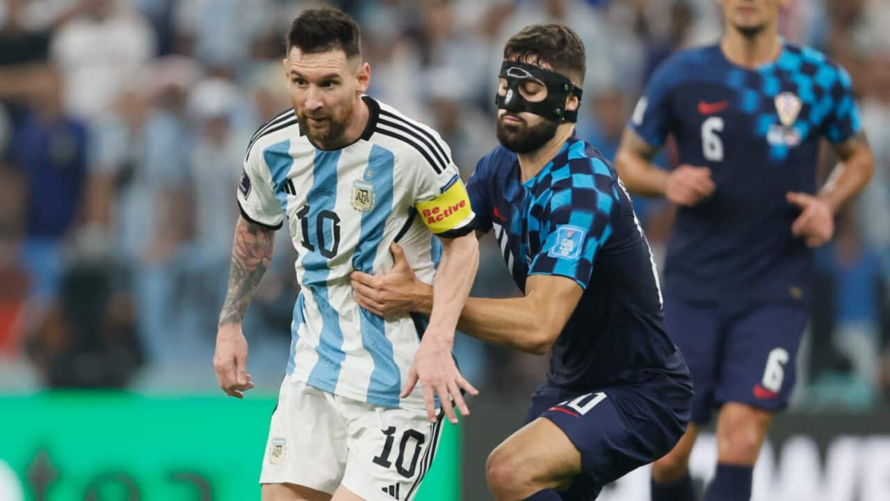 Croatia's Josko Gvardiol attempts to stop Argentina's Lionel Messi