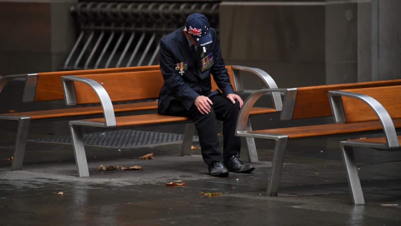 An elderly man sits after attending an Anzac Day Dawn Service in Sydney (AAP)