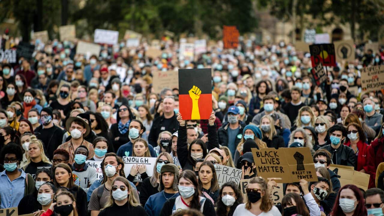 Protesters participate in a Black Lives Matter rally in Adelaide on Saturday, June, 6, 2020. A protest against the deaths of Aboriginal people in custody and solidarity with the US protests for George Floyd. (AAP Image/Morgan Sette) NO ARCHIVING