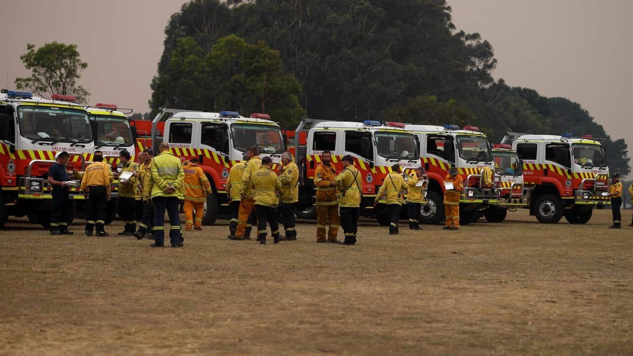 NSW Rural Fire Service crews assemble at a staging area as the Wrights Creek fire approaches Kulnura on the NSW Central Coast