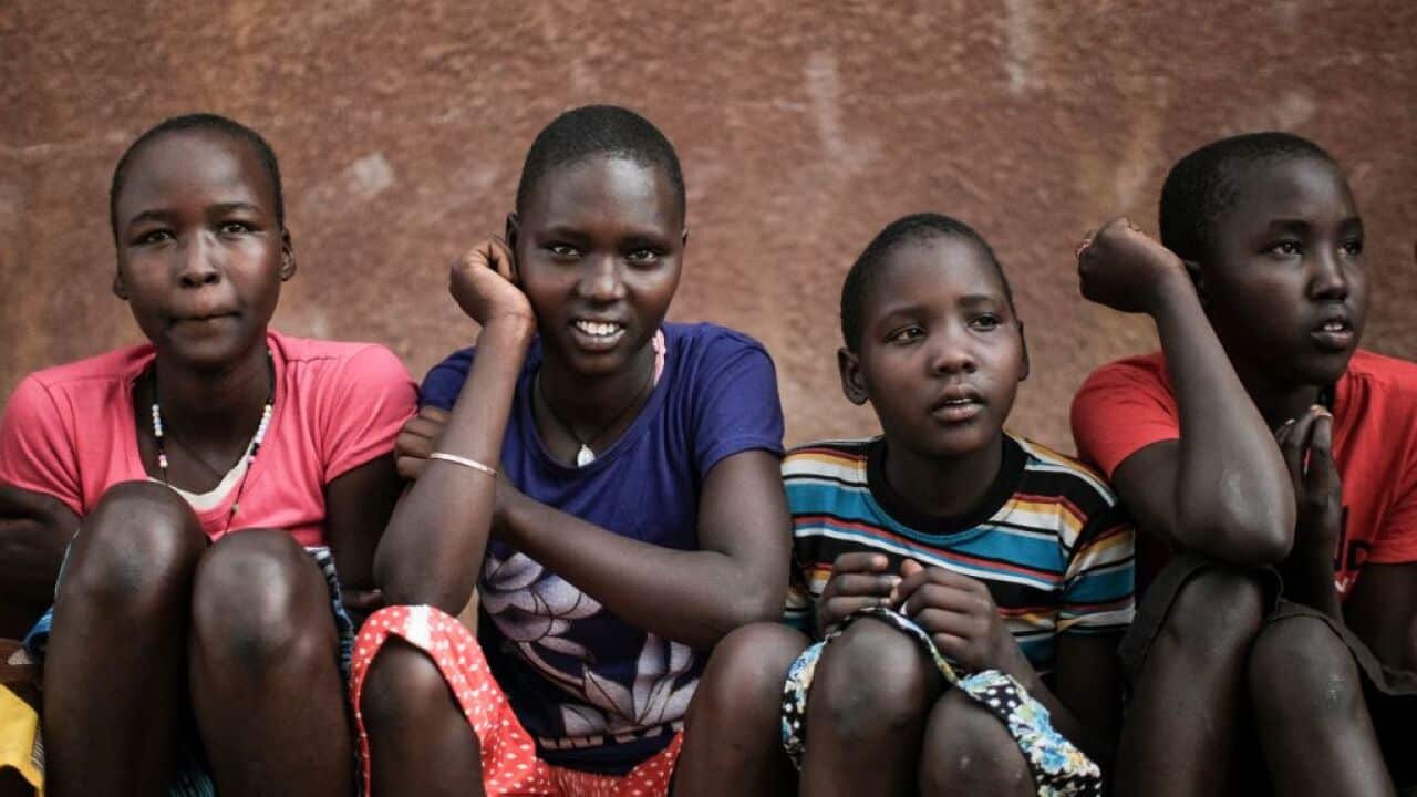 Students of Kalas Girl's primary school, which hosts escaped girls from female genital mutilation (FGM) and child marriage, pose in Amudat town, northeast Uganda, on January 31, 2018.