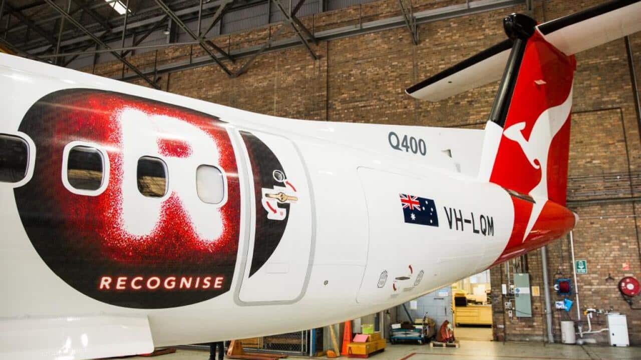 Recognise logo on Qantas plane.