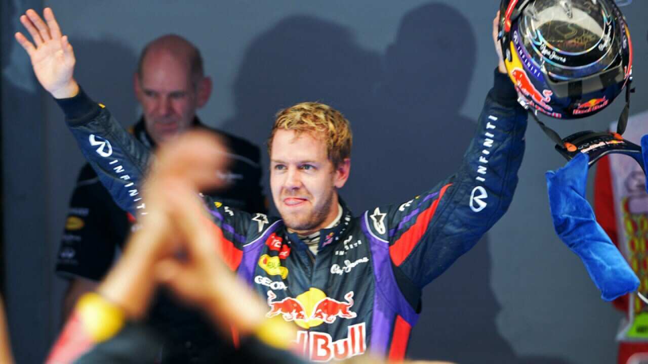 Sebastian Vettel (C) celebrates winning the Indian Grand Prix