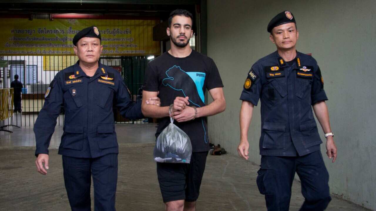 Thai prison guards lead Hakeem al-Araibi, second left, from a court house in Bangkok on 11 December 2018. 