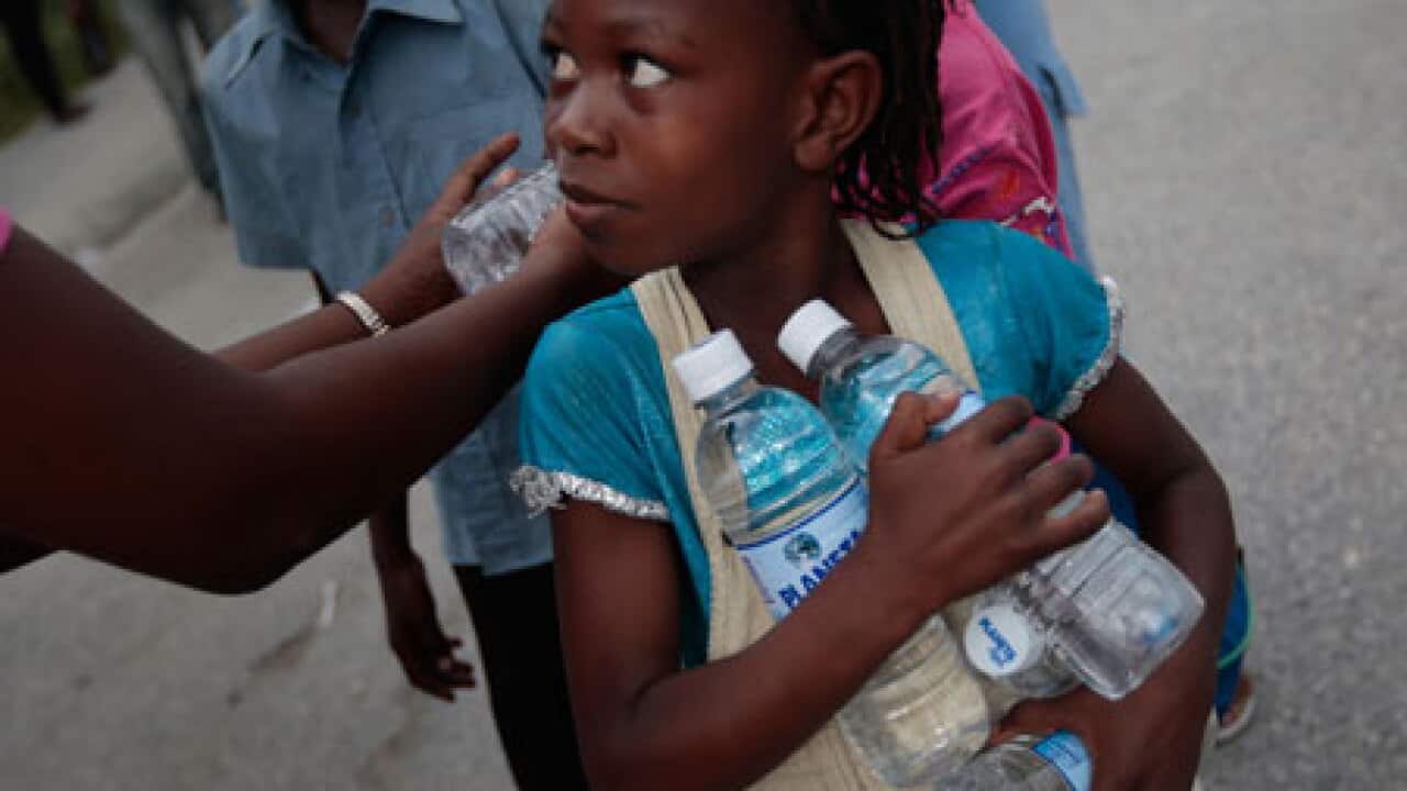 haiti_girl_water_bottles_100120_B_getty_1823881202