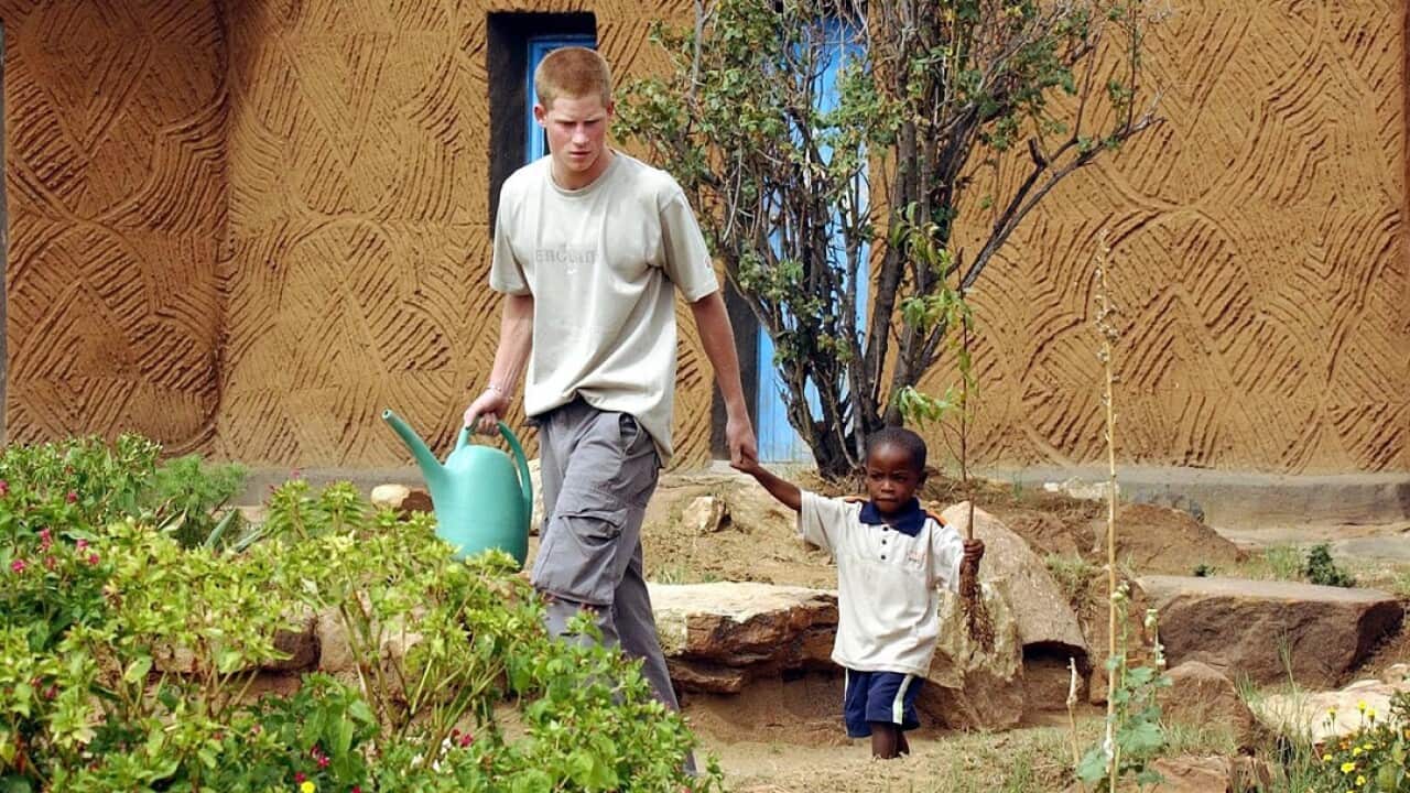 Prince Harry with Mutsu Potsane during a visit to Lesotho.