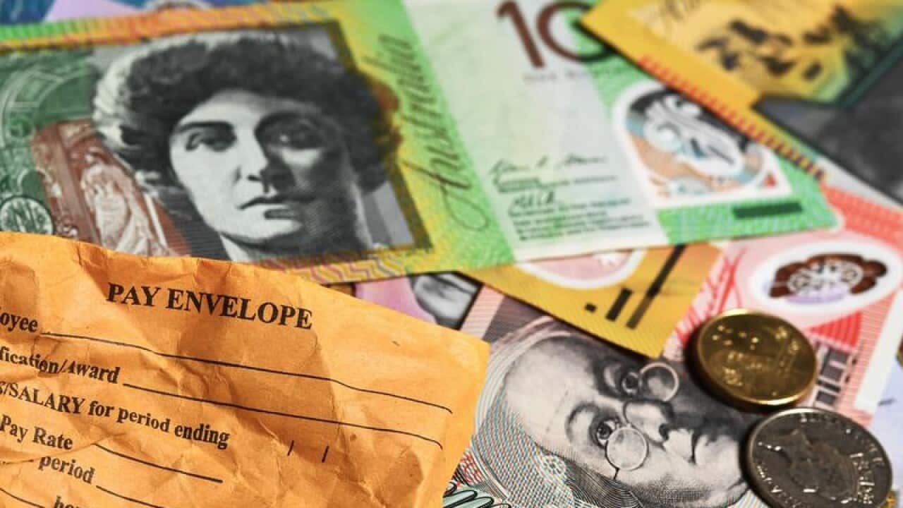A stock photograph of Australian currency and a wages envelope