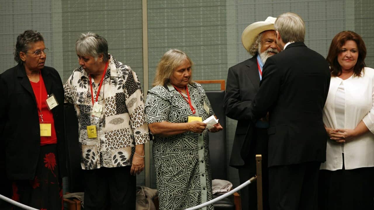 February 13, 2008: Kevin Rudd greets Indigenous representatives in the House of Representatives Chamber after delivering the apology to the stolen generation.