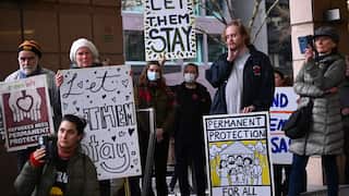 Refugees and supporters rally outside the Immigration Department in Melbourne, Wednesday, August 24, 2022.