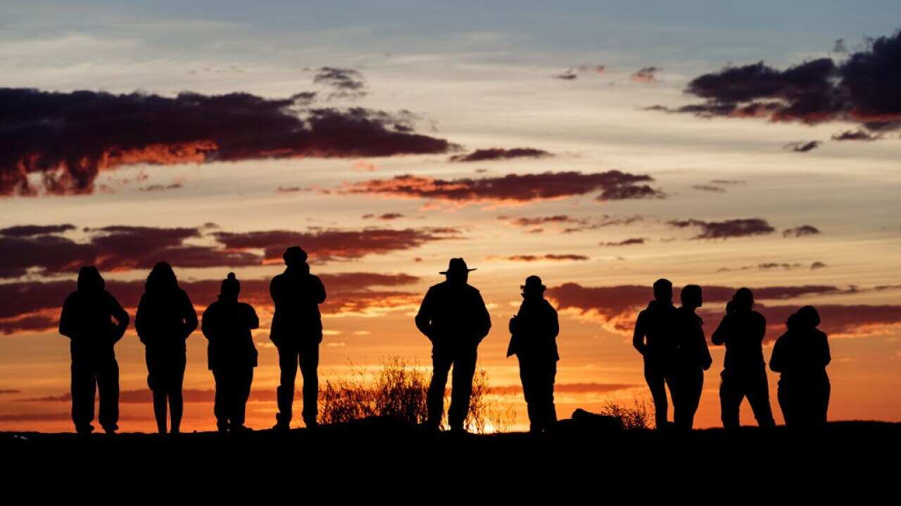 The sun rises over the Simpson Desert in outback Australia.