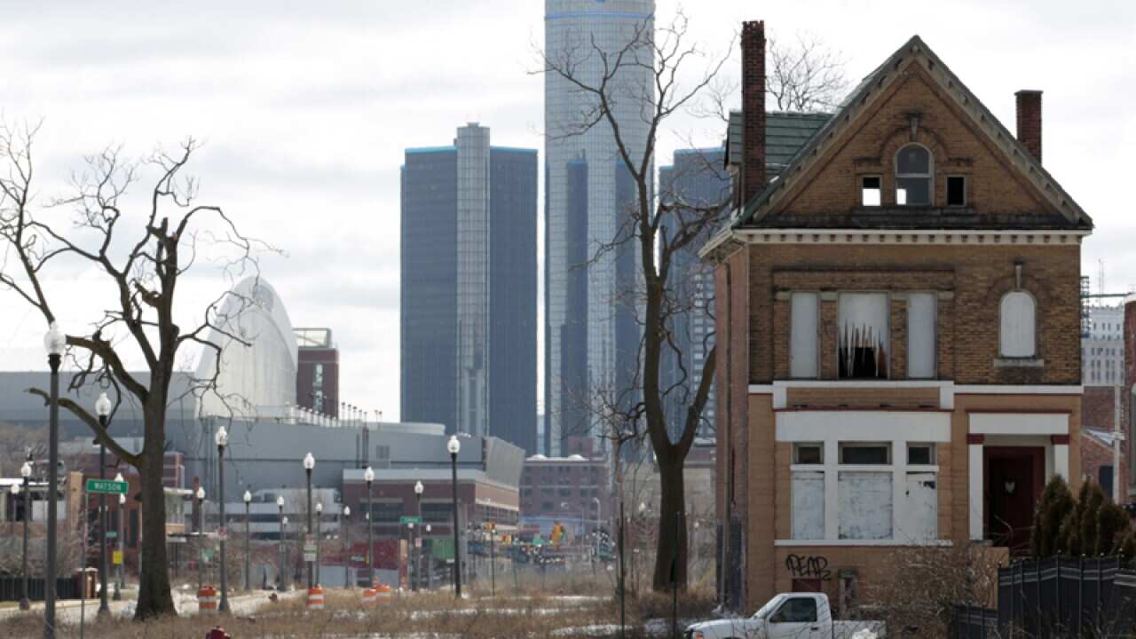 An empty house with the GM Building in the background