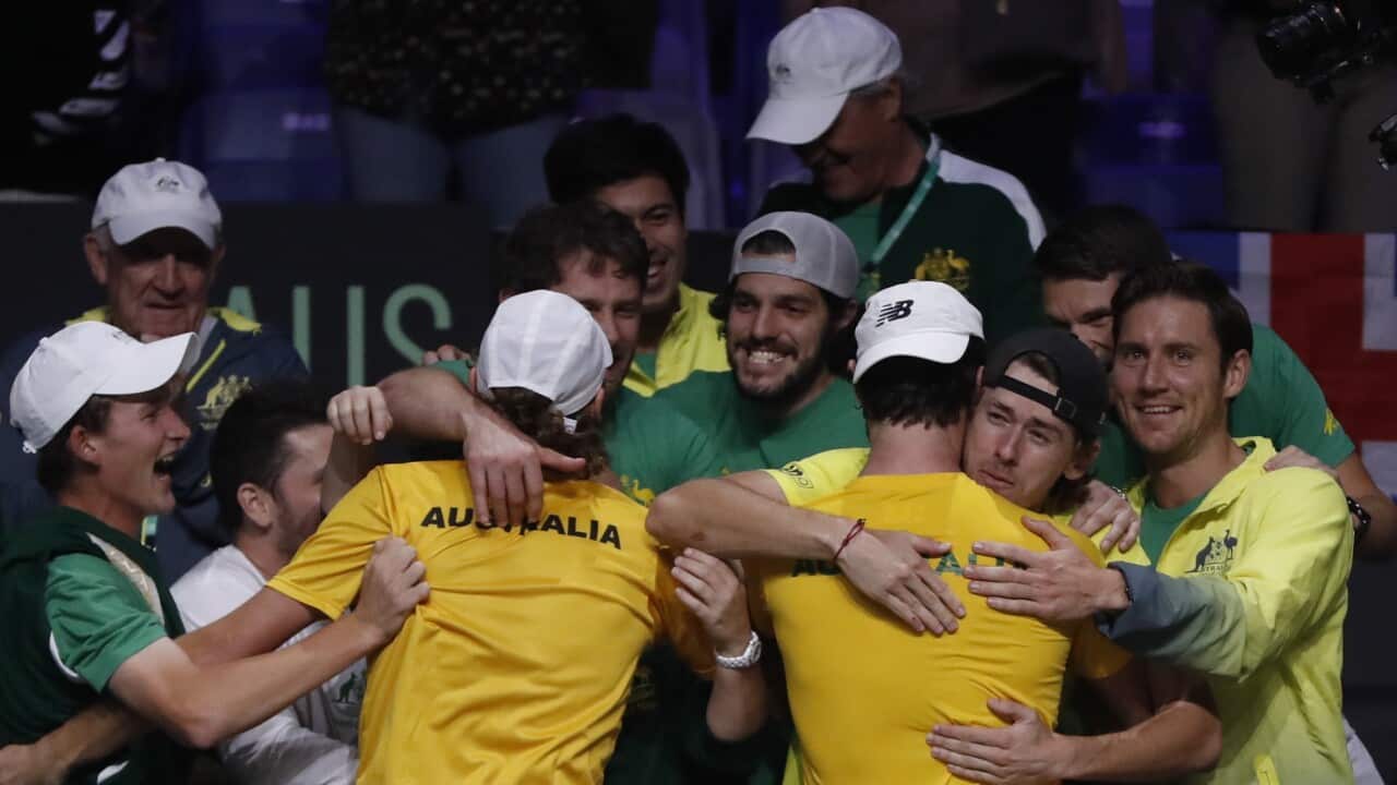 Australia's Jordan Thompson (R) and Max Purcell (L) celebrate with teammates after beating Croatia in the 2022 Davis Cup semi final
