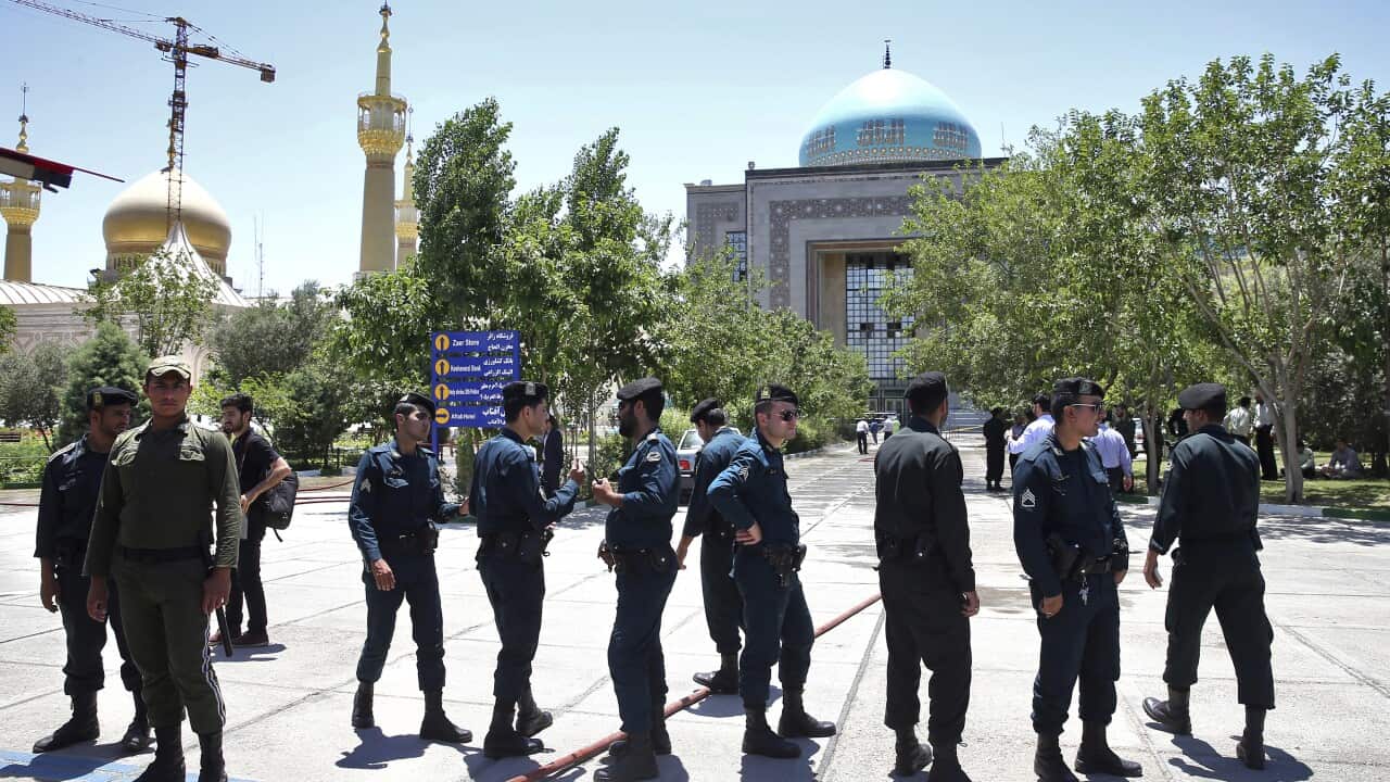Police officers control the scene, around of shrine of late Iranian revolutionary founder Ayatollah Khomeini